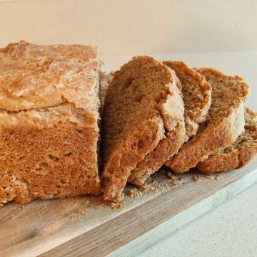 sprouted wheat bread sliced on a cutting board