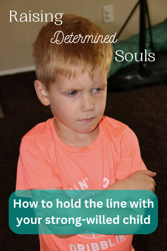 strong-willed child pouting, looking away, arms crossed